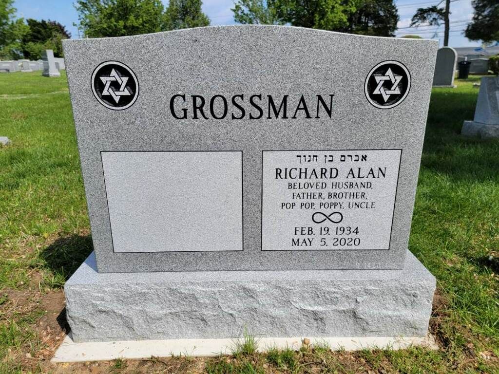 Gray gravestone marked “GROSSMAN” with Stars of David in a cemetery, bearing the name Richard Alan.