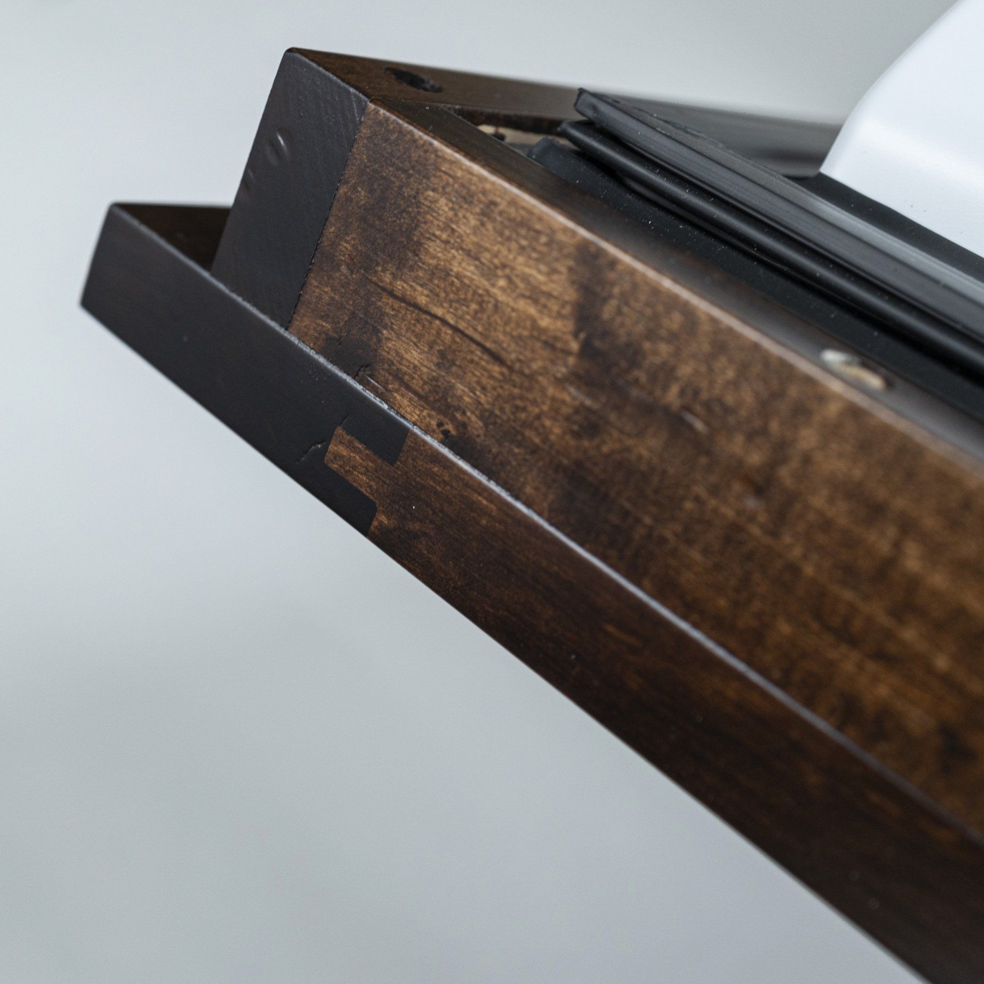 A close up of a wooden box with a piece of paper in it