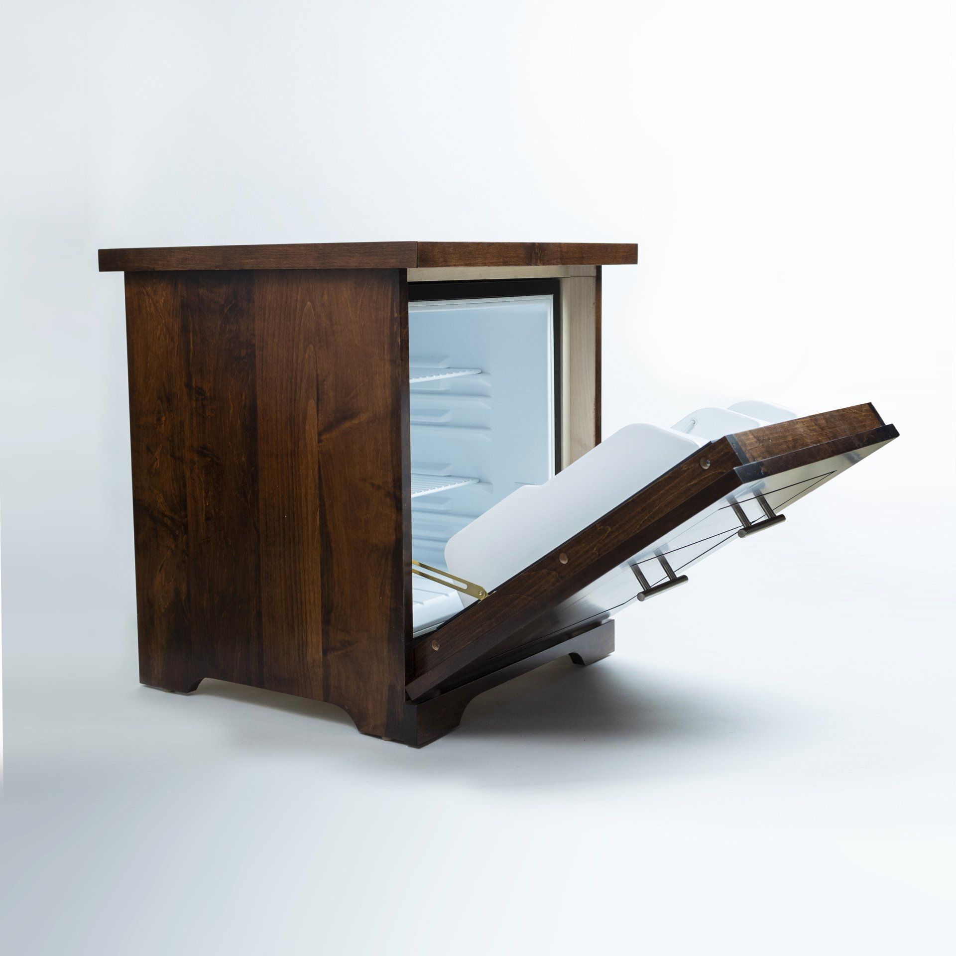 A small wooden cabinet with the door open