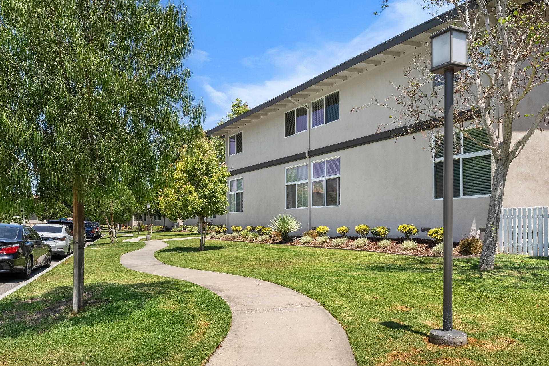winding sidewalk with landscaping