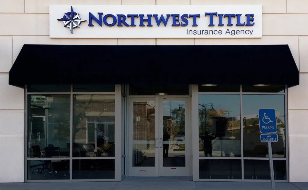 Northwest Title Insurance Agency storefront with black awning and glass doors