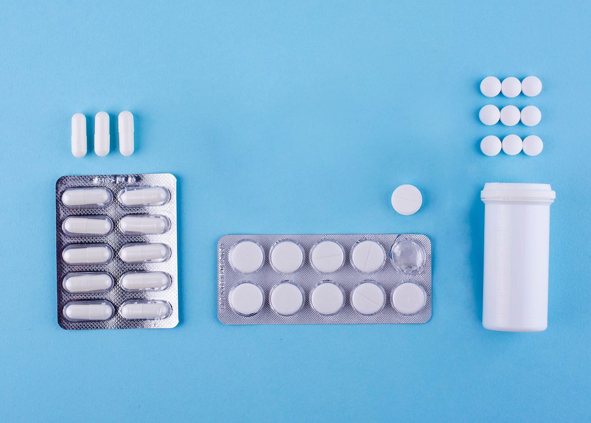 there are many different types of pills on a blue background .