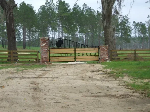 Custom Double Drive Gate with 4 Board Wood Fence — Valdosta, GA — Sims Fence Company