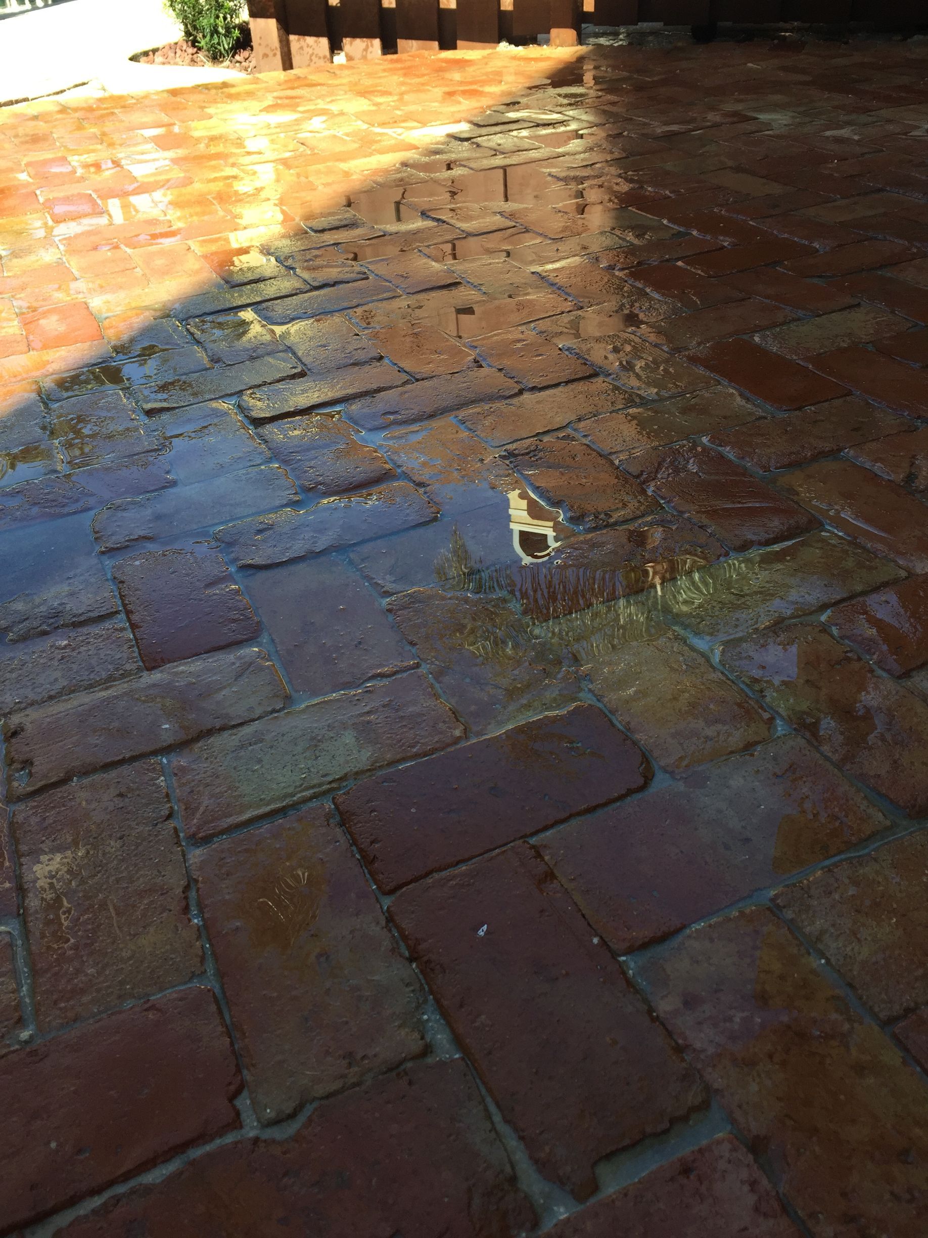 Parking lot with painted white lines, a handicap symbol, and a blue building in the background.