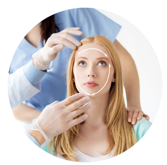 A woman is getting her face measured by a doctor