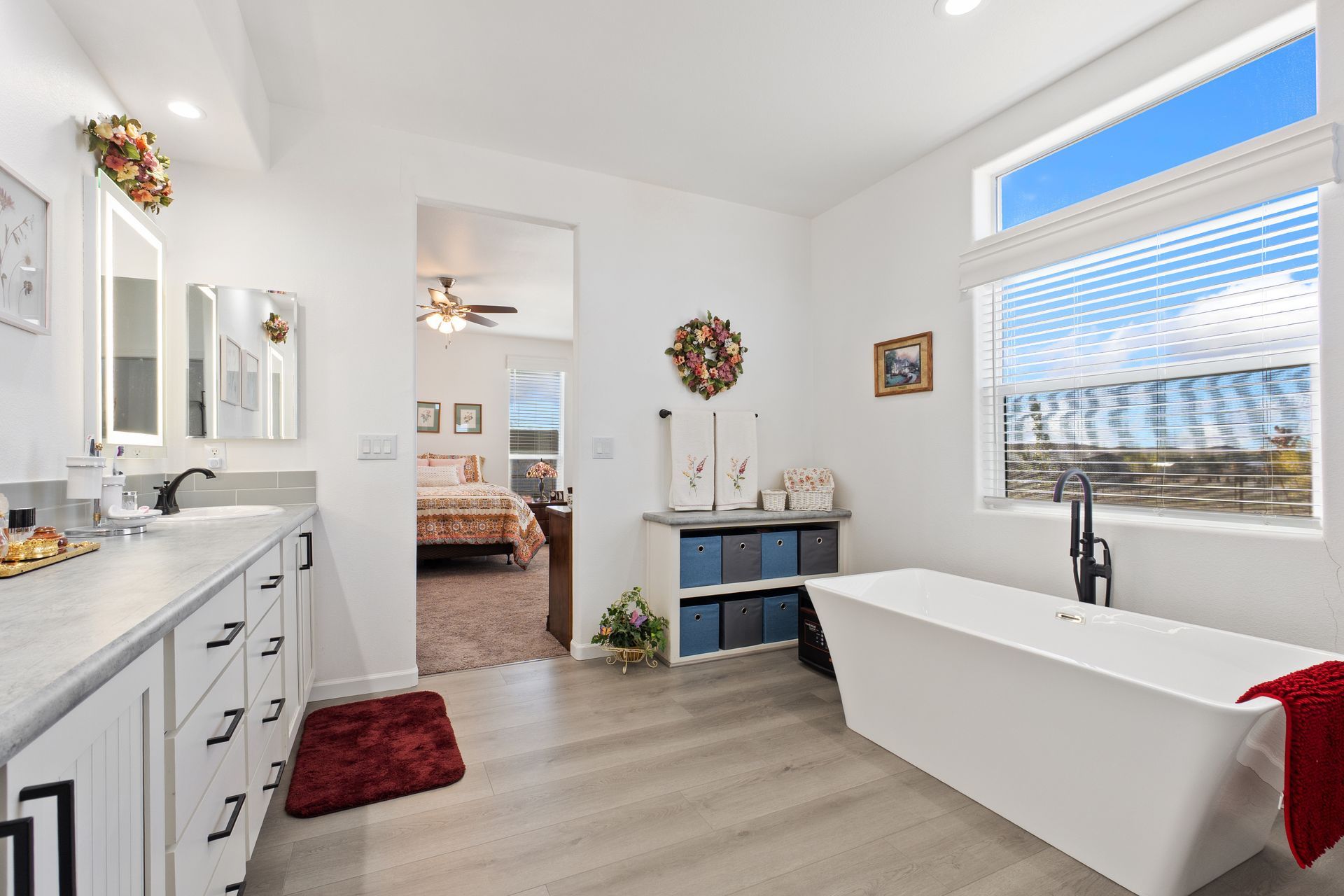 A well-designed bathroom that features a tub.