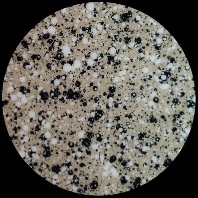 Speckled pattern: tan background with black and white spots.
