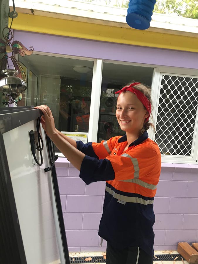 Woman Holding Solar Panel — Solar Power Provider in Emerald, QLD