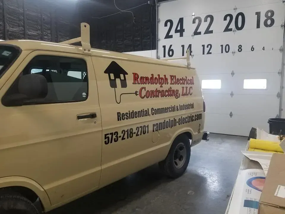 Tan van with ladder rack,