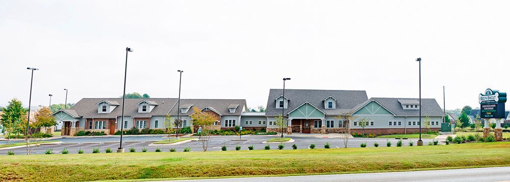 Exterior campus view of Flint River Animal Hospital with craftsman-style architecture and landscaping