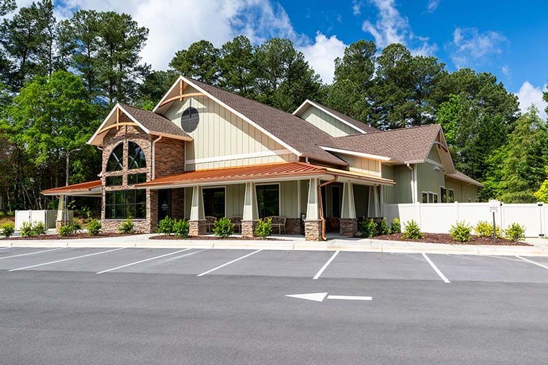 Exterior front view of Grace Animal Hospital with landscaping and parking area