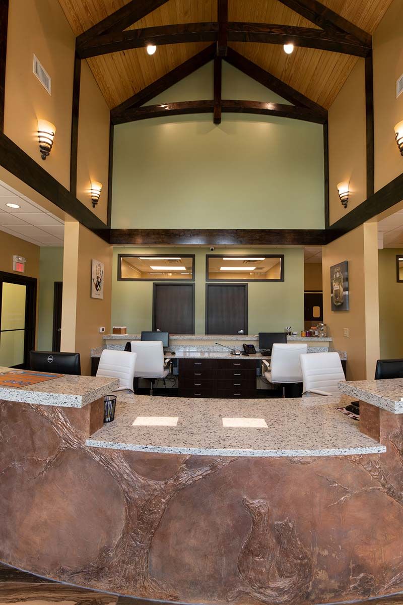 Comfortable waiting area with vaulted ceiling and warm lighting at Grace Animal Hospital