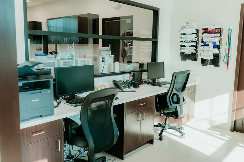 Reception desk and check-in area at Kind Animal Care veterinary clinic