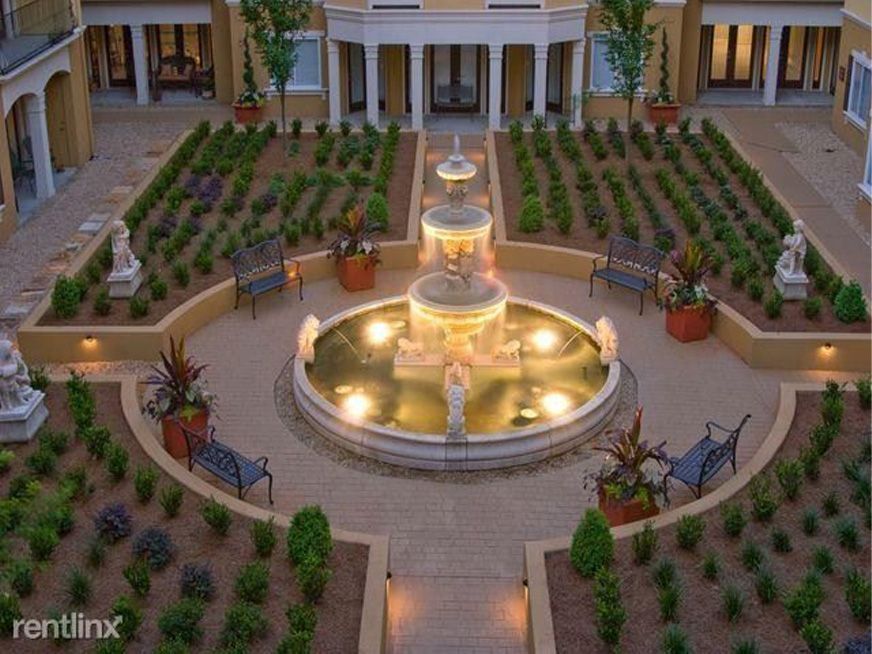 Aerial view of Windsor at Midtown Atlanta courtyard with illuminated fountain and landscaped gardens