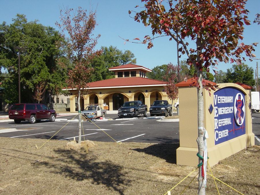 Exterior view of Veterinary Emergency Referral Center building with parking area and mature trees