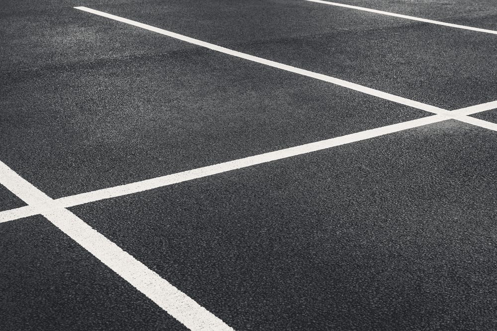 A Black and White Photo of a Parking Lot With White Lines — North Coast Line Marking in Yamba, NSW