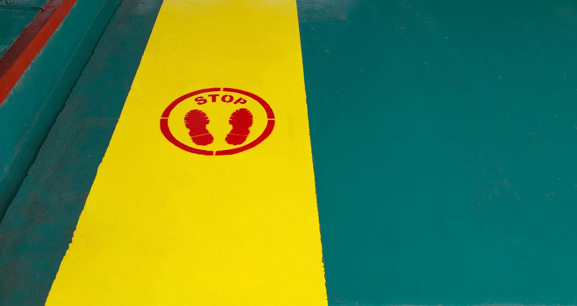 A Yellow and Green Striped Floor With a Stop Sign on It — North Coast Line Marking in Maclean, NSW
