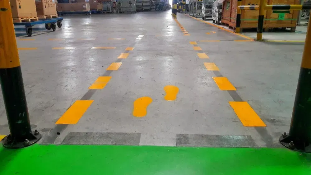 A Warehouse With Yellow Lines Painted on the Floor — North Coast Line Marking in Byron Bay, NSW
