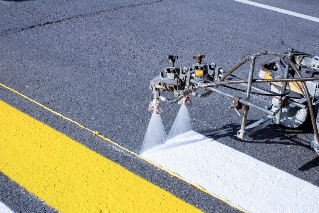 A Machine is Spraying Yellow Paint on a Road — North Coast Line Marking in Grafton, NSW