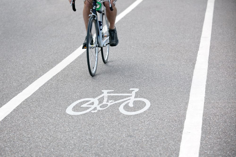 A Person is Riding a Bike on a Bike Lane — North Coast Line Marking in Toowoomba, NSW
