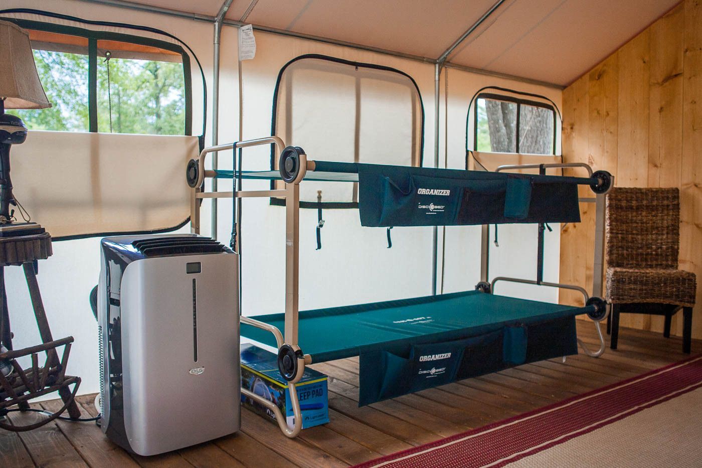 There is a bunk bed and a chair in the room.