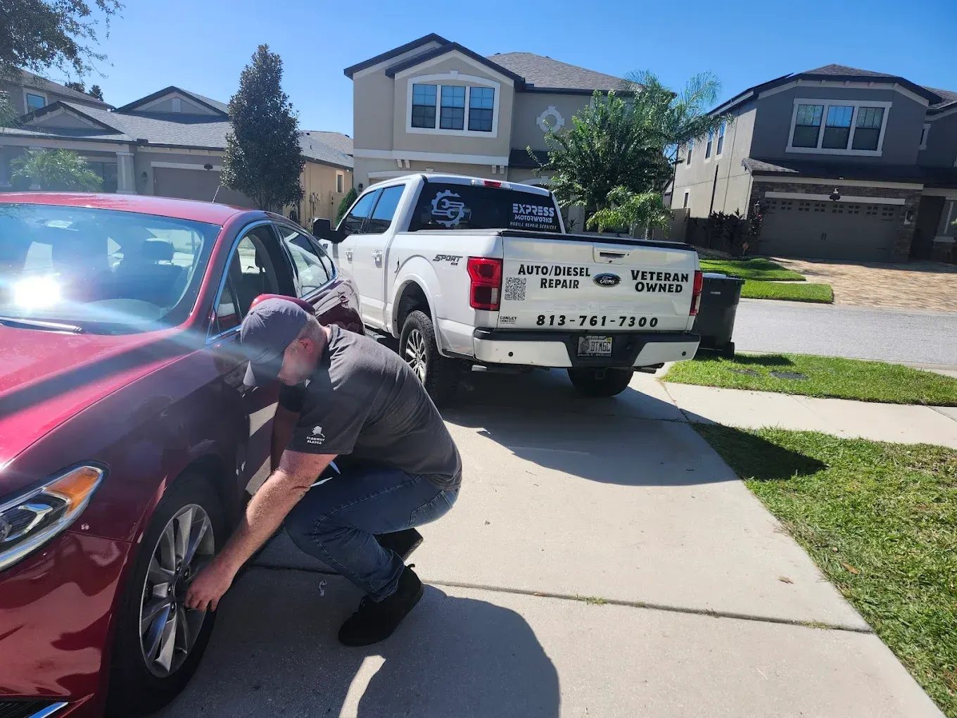 Service Truck Parked Behind Red Car | Express Motorworks