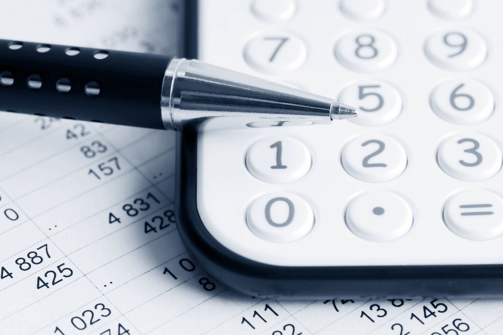 A Pen Rests on Top of a Calculator — D&T Accounting & Bookkeeping In Umina Beach, NSW