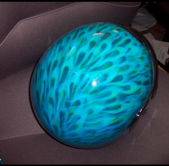 A blue helmet with a leopard print on it