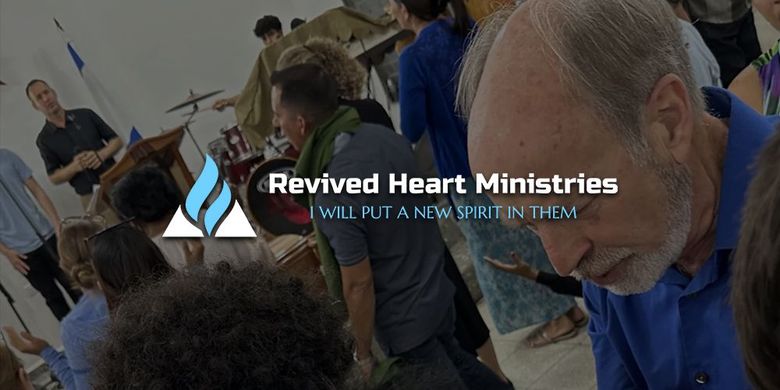 People praying in a church with overlay text: “Revived Heart Ministries” and “We’ll put a new heart in them.”