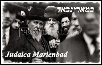 A black and white photo of a group of men with the caption judaca marienbad