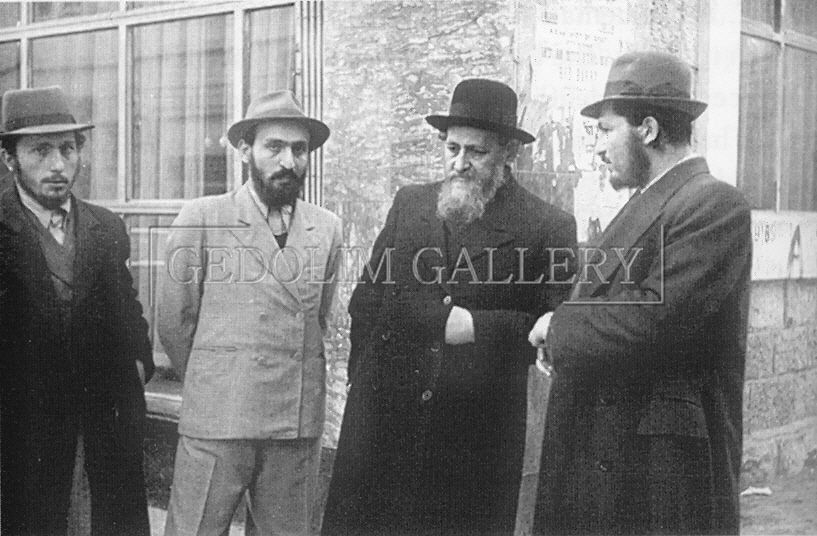 A group of men standing in front of a building with the word gallery on the bottom