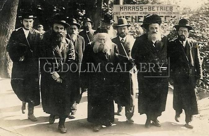 A group of men are walking down a sidewalk in front of a sign that says marss-betrieb
