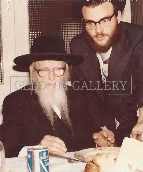 Two men are sitting at a table with a can of diet coke in front of them