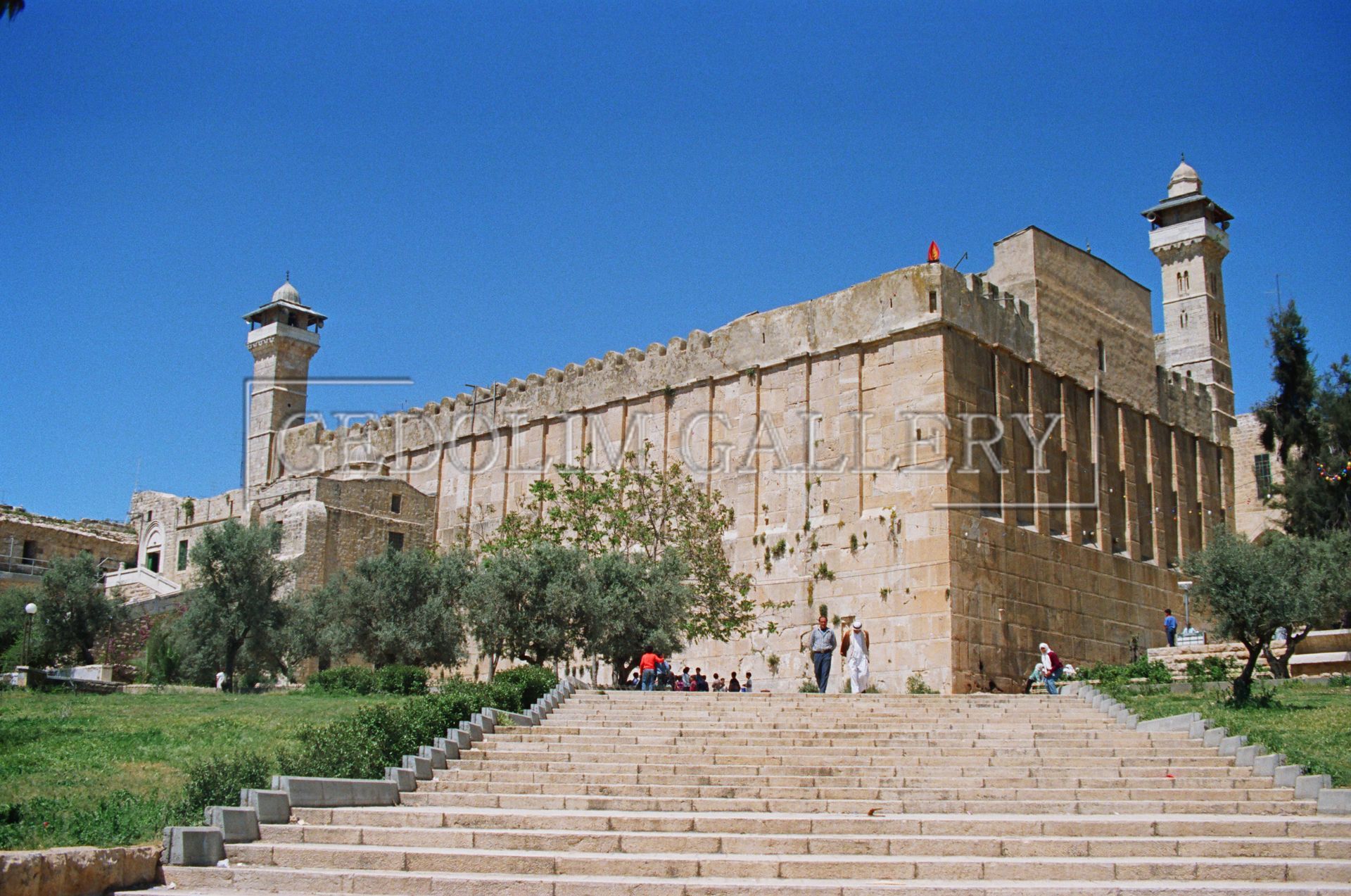 A large stone building with stairs leading up to it