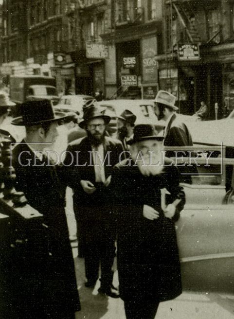 A black and white photo of a group of men with the word gedolim gallery on the bottom