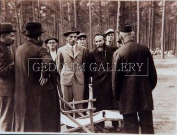 A black and white photo of a group of men with the caption gedorium gallery