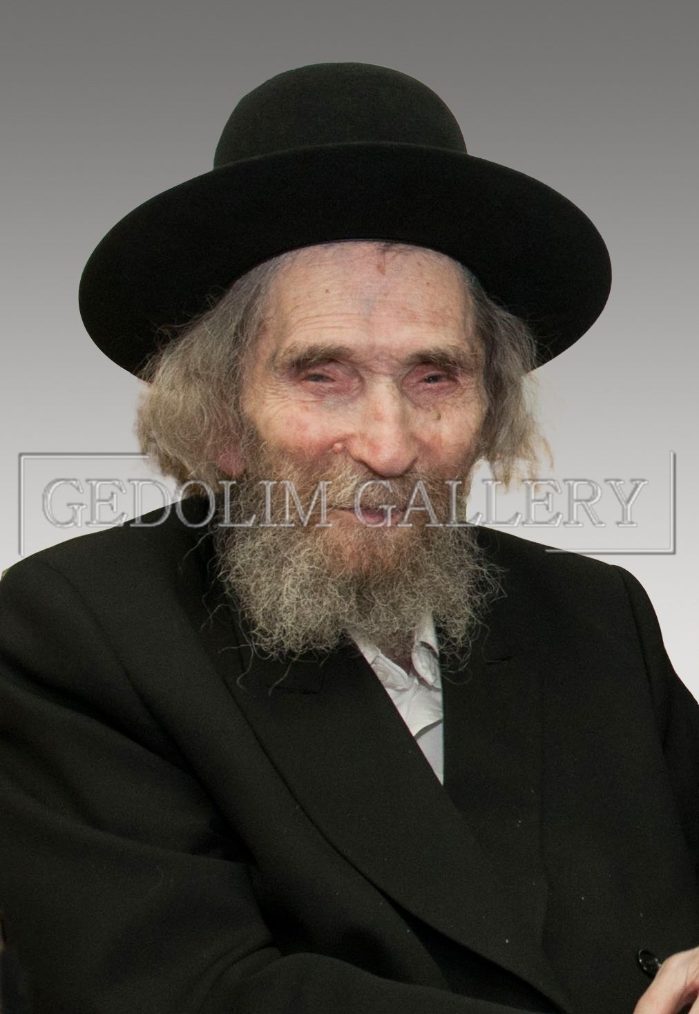 A man with a beard wearing a black hat