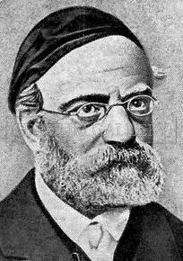 A black and white portrait of a man with a beard wearing glasses and a hat.
