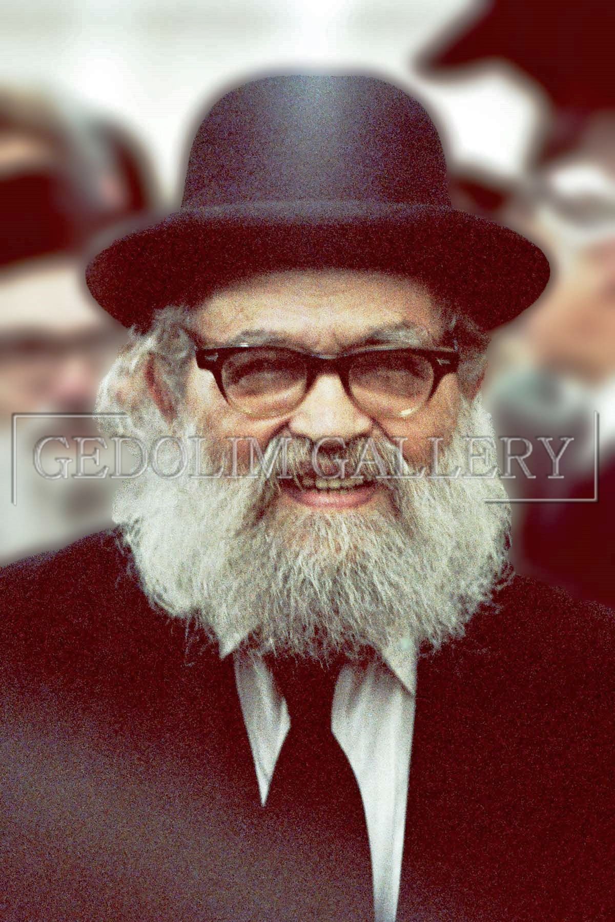 A man with a beard wearing a hat and glasses