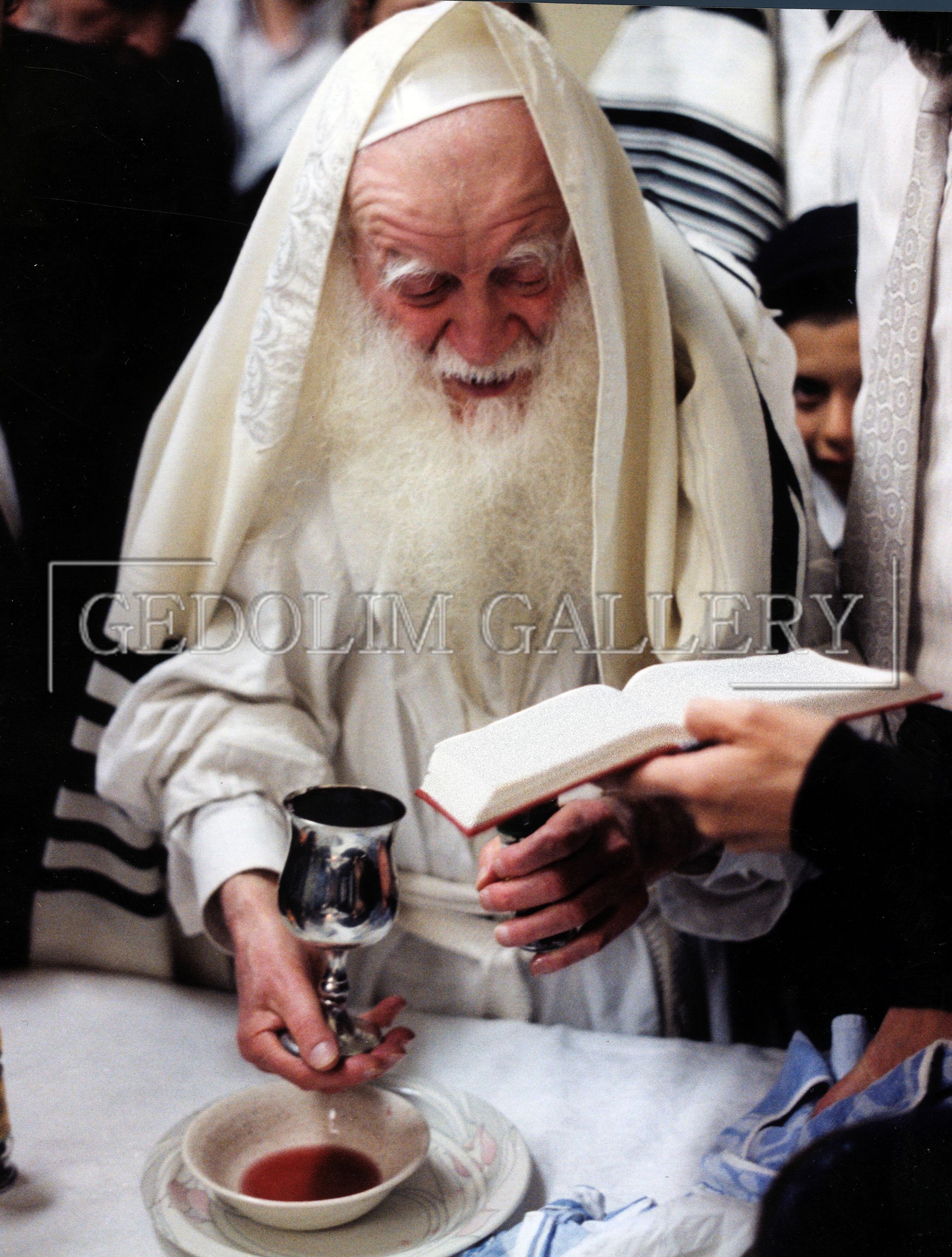 A man with a beard is reading a bible