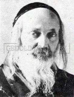 A black and white photo of a man with long hair and a beard.