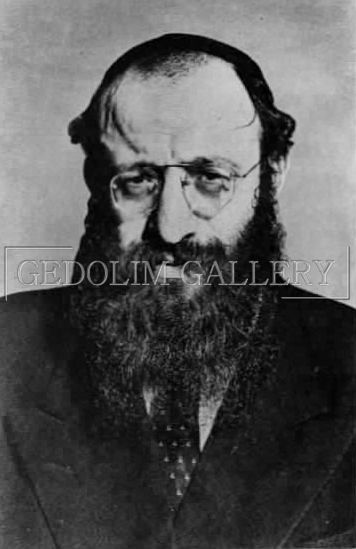 A black and white photo of a man with a beard and glasses