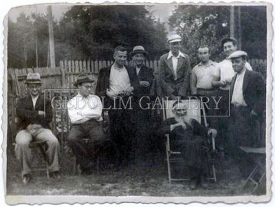 A group of men are posing for a picture in a black and white photo.