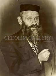 A man with a beard and hat is wearing a suit and tie.