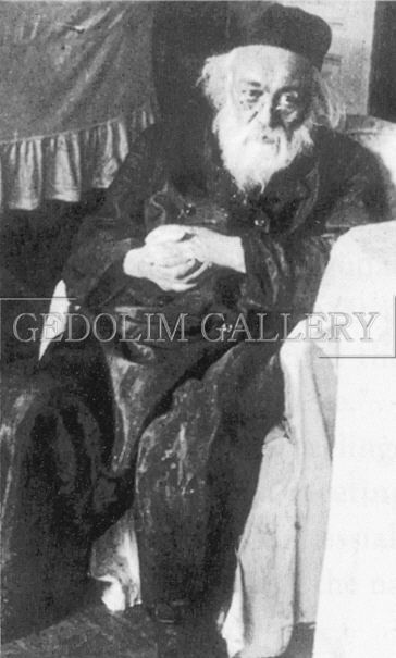A black and white photo of a man with a beard
