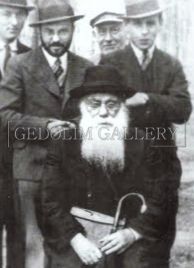 A group of men in suits and hats are posing for a picture.