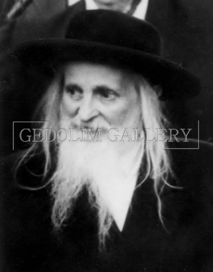A black and white photo of a man with long hair and a beard
