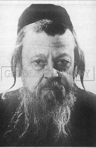 A black and white photo of a man with a beard and a hat.