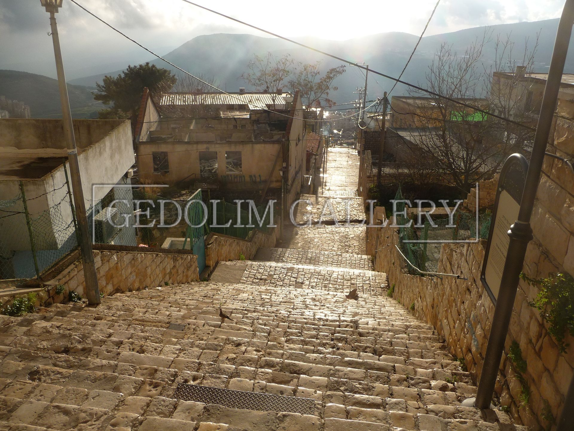 A stone staircase leading up to the cedolim gallery