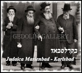 A black and white photo of a group of men with hebrew writing